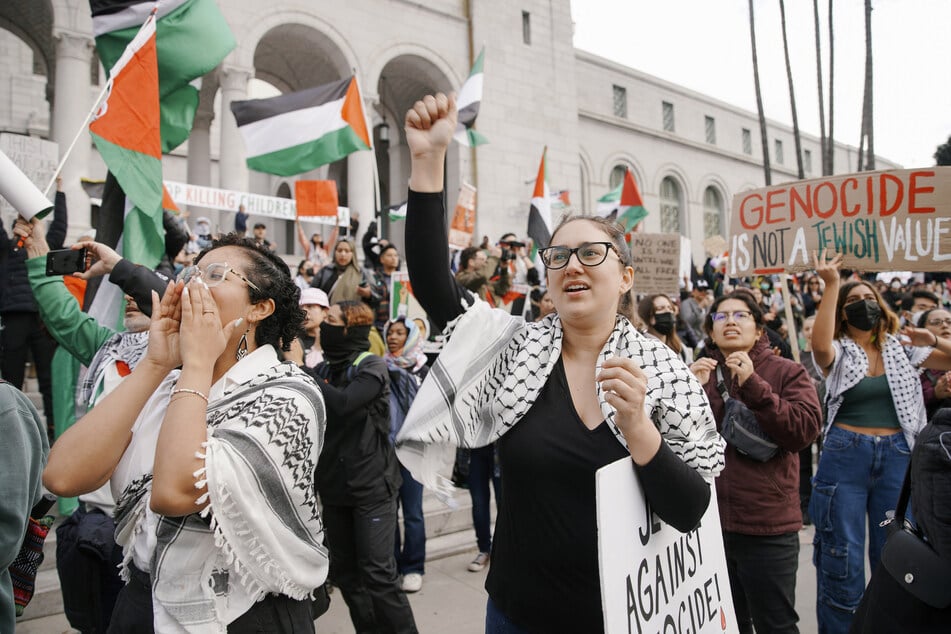 Protesters rally in front of Los Angeles City Hall in support of Palestinians under US-backed Israeli assault.