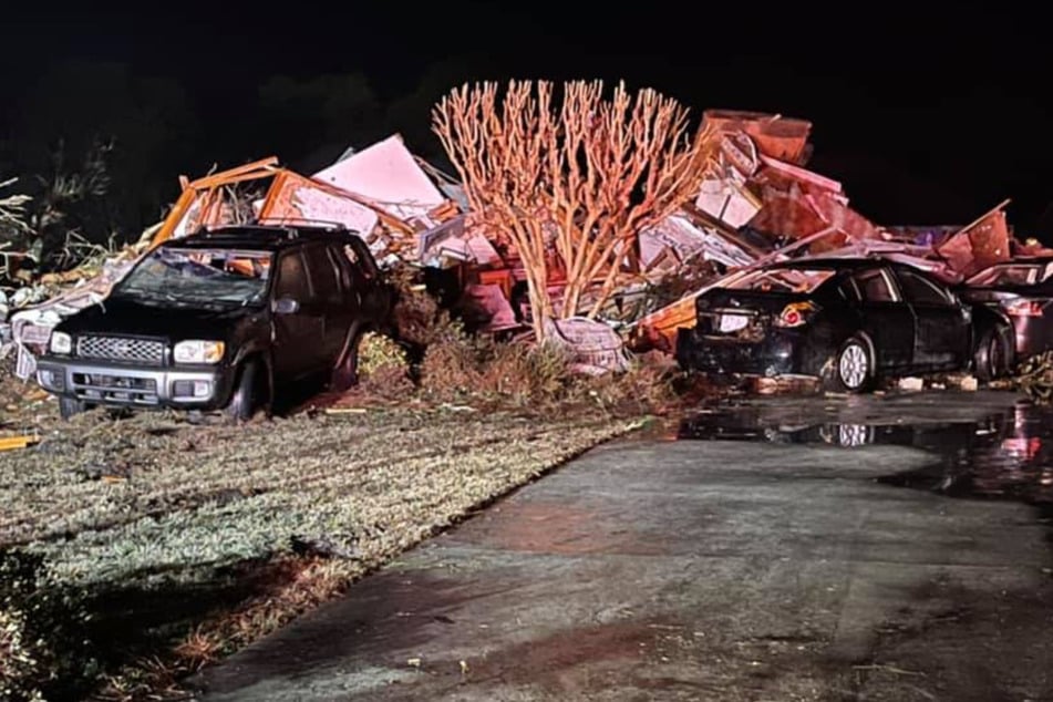 The devastating tornado snapped trees, hit cars, and destroyed houses along its path.