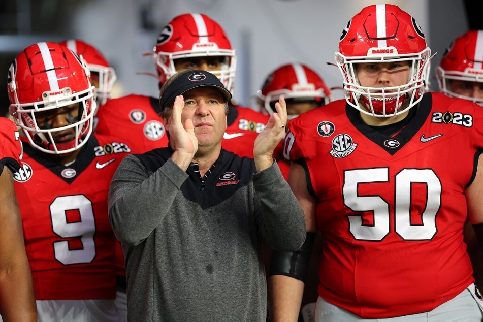 Contrary to what coach Kirby Smart (c) believes, college football fans across the country seem to disapprove of Georgia's schedule this season.