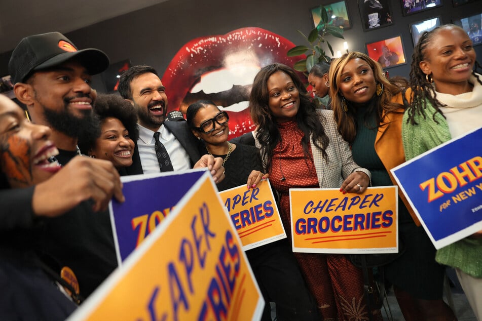 Zohran Mamdani takes photos with supporters inside of Lips Cafe in Brooklyn alongside Assemblymember Rodneyse Bichotte Hermelyn and Councilmember Farah Louis on October 25, 2025.