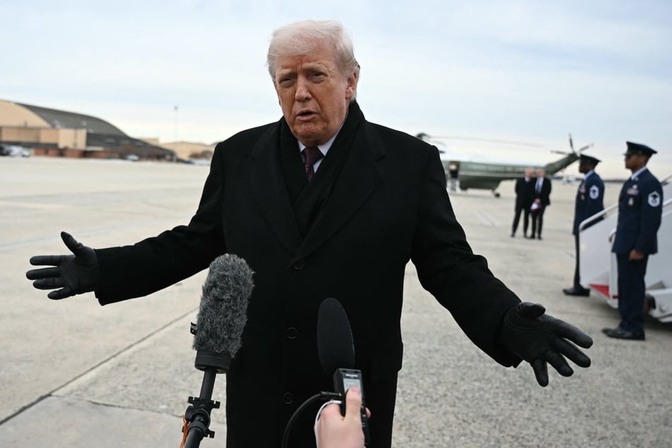 President Donald Trump speaks to reporters after stepping off Air Force One at Joint Base Andrews on Wednesday upon return from Dover Air Force Base in Delaware, where he attended a ceremony for the return of the remains of two Iowa National Guard members and a translator killed in an attack in Syria.
