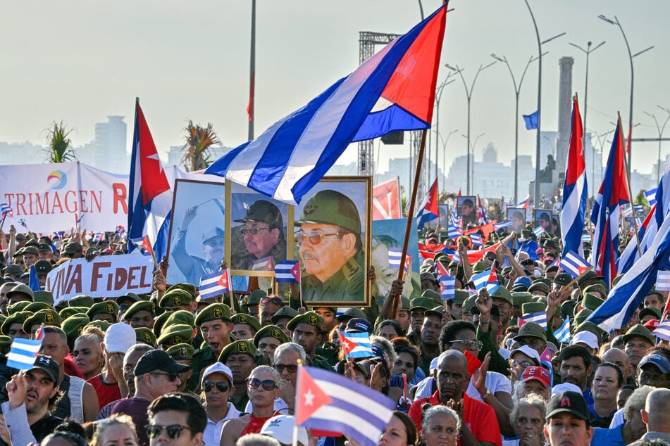 Castro supporters rally outside US embassy in Havana after indictment