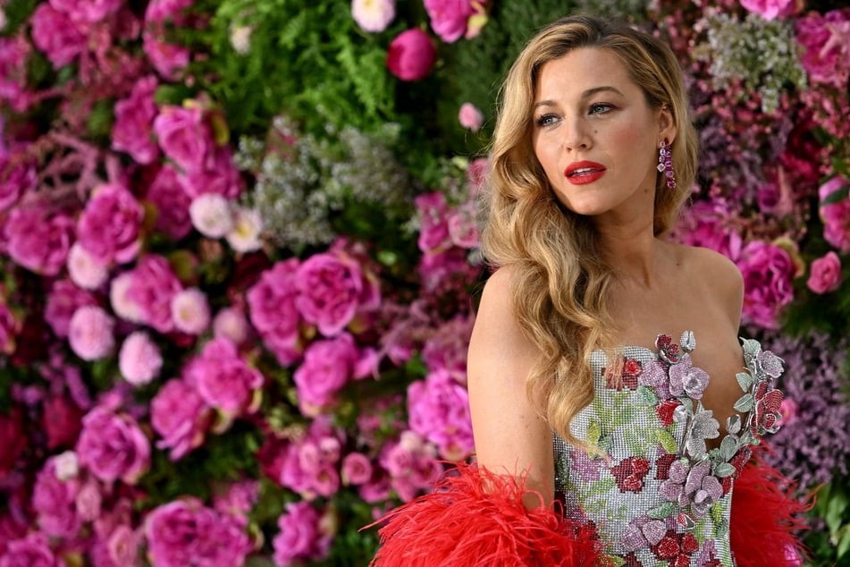 Blake Lively poses on the red carpet upon arrival to attend the UK gala screening for It Ends With Us at the Odeon Luxe in Leicester Square, central London on August 8, 2024.