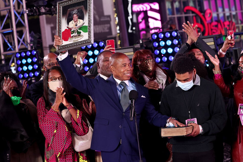 Eric Adams (c.) is sworn in as the 110th mayor of the city of New York on January 01, 2022 in New York, NY. Due to a surge in COVID-19 cases, the official inauguration has been postponed, and Adams chose to be sworn into office in Times Square following the annual New Years Eve ball drop.