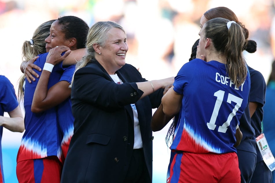 USWNT coach Emma Hayes (c.), who was only hired in May, paid tribute to her players after the record-extending Olympic win.