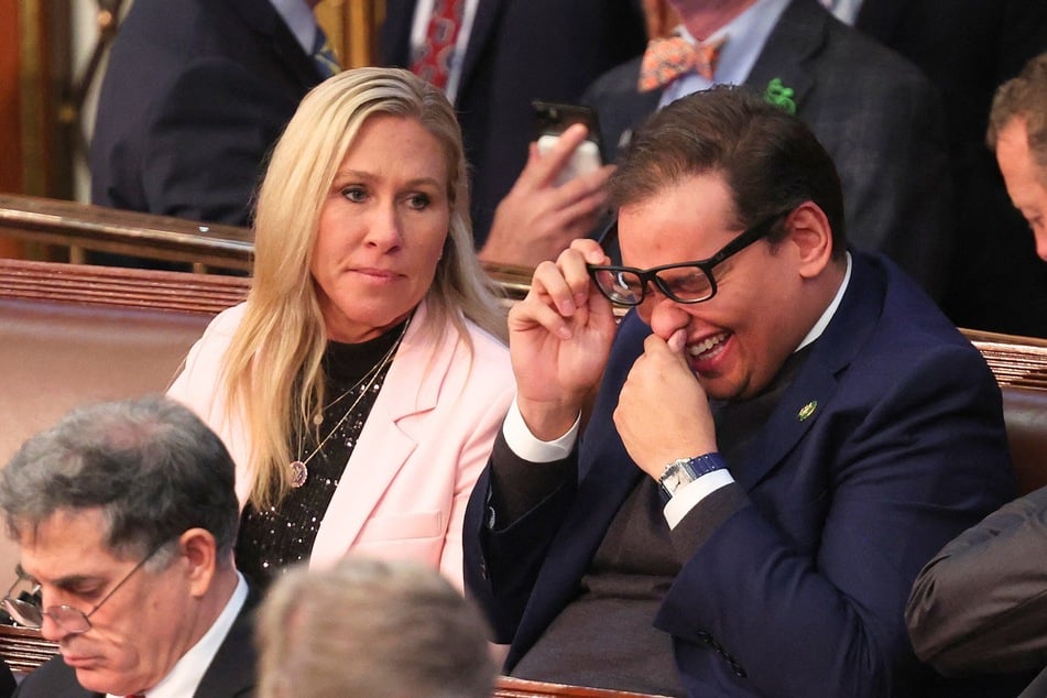 Marjorie Taylor Greene (l.) and George Santos (r.) in the House Chamber during the third day of elections for Speaker of the House at the US Capitol Building in Washington, DC on January 5, 2023.