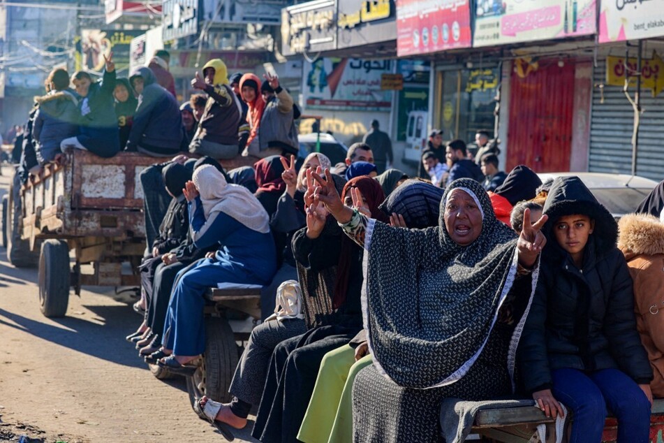 Displaced Palestinians use a tractor as a means of transportation in Rafah in the southern Gaza Strip.