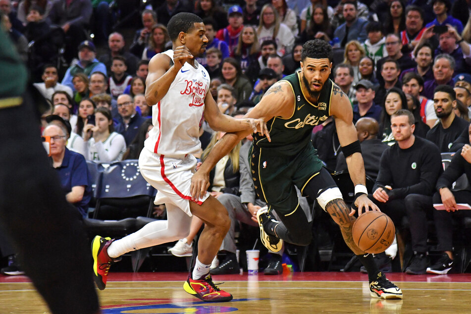 Boston Celtics forward Jayson Tatum drives to the basket against Philadelphia 76ers guard De'Anthony Melton during the first quarter at Wells Fargo Center.