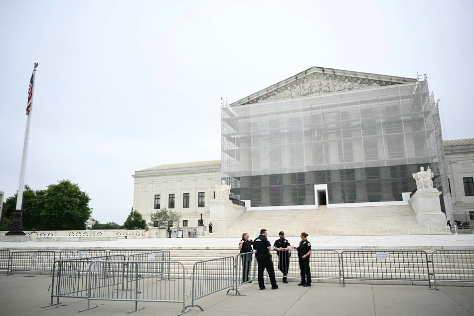 US Supreme Court Police officers stand outside the Supreme Court in Washington, DC, on Friday.