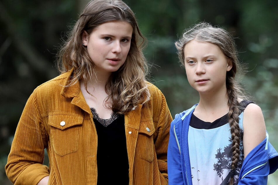 Die Klimaschutzaktivistinnen Luisa Neubauer (24) (l) und Greta Thunberg (17) fordern die Staatengemeinschaft auf, viel mehr für den Klimaschutz zu tun.