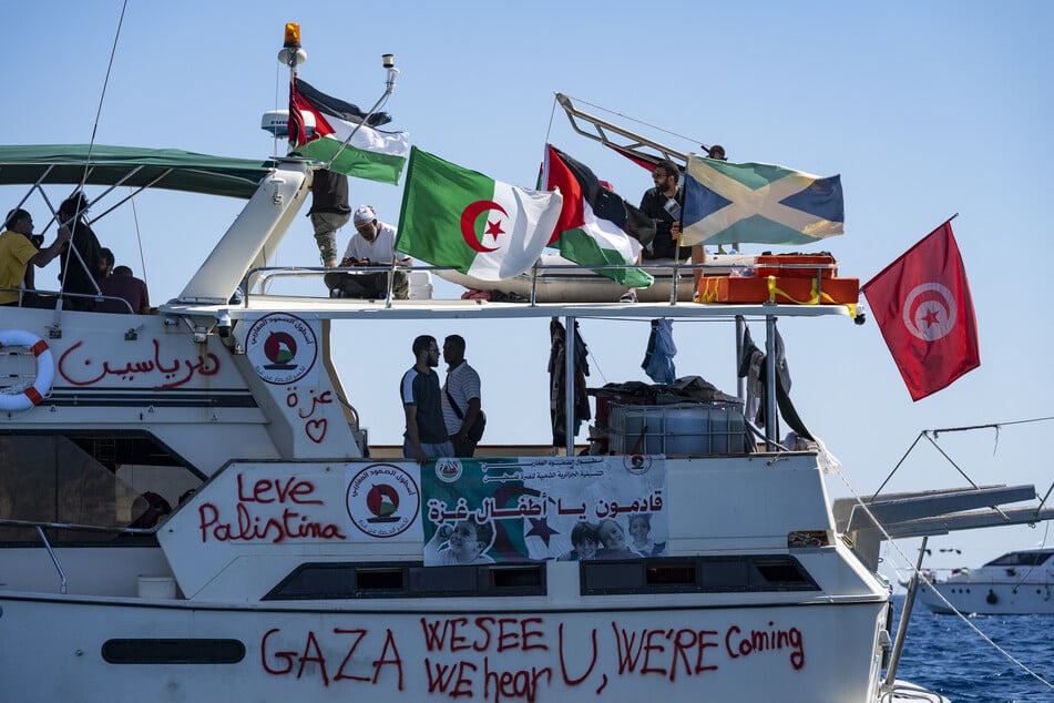 Members of the group of ships of the Global Sumud Flotilla to Gaza are seen moored at the small island of Koufonisi, south of the island of Crete, on September 26, 2025.