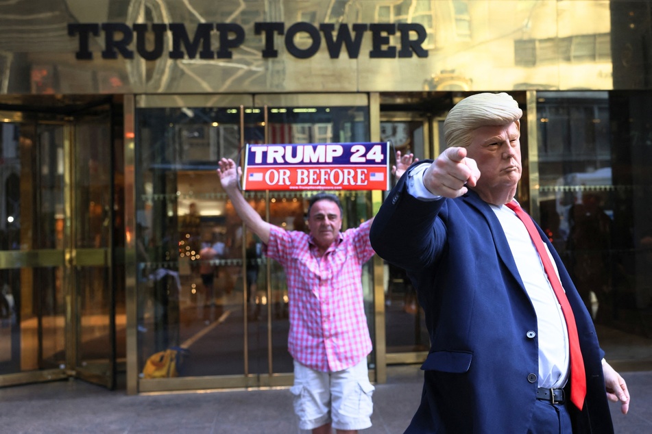 A MAGA supporter and a Donald Trump impersonator outside of Trump Tower in New York City on April 12, 2023.