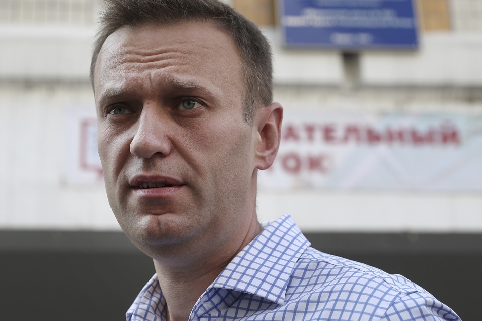 Alexej Nawalny (44), leader of the opposition in Russia, stands in front of the polling station after voting.