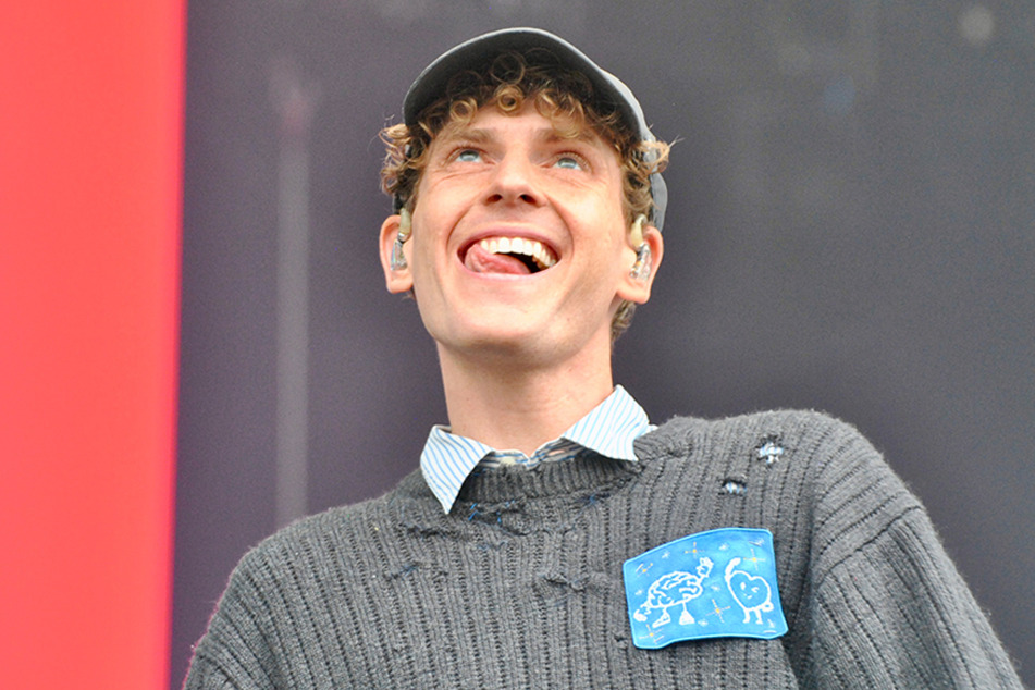 COIN's lead singer Chase Lawrence hopped off stage to help a fan during his set.