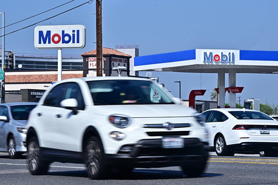 Vehicles pass an ExxonMobil gas station in Rosemead, California.