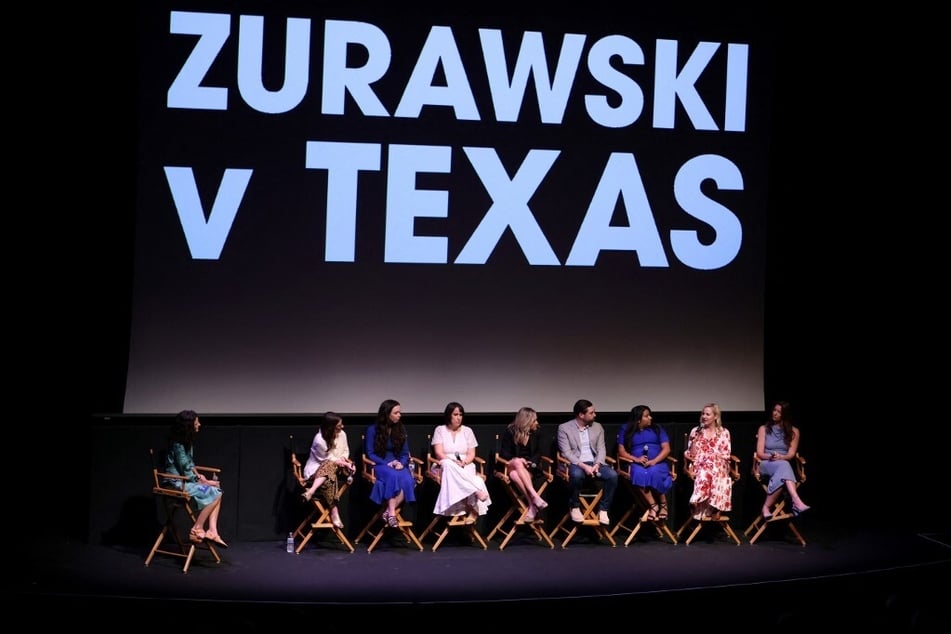 Holly Herrick, Maisie Crow, Abbie Perrault, Molly Duane, Amanda Zurawski, Josh Zurawski, Samantha Casiano, Austin Dennard, and Elizabeth Monteleone speak onstage during a screening of Zurawski v. Texas in Austin.