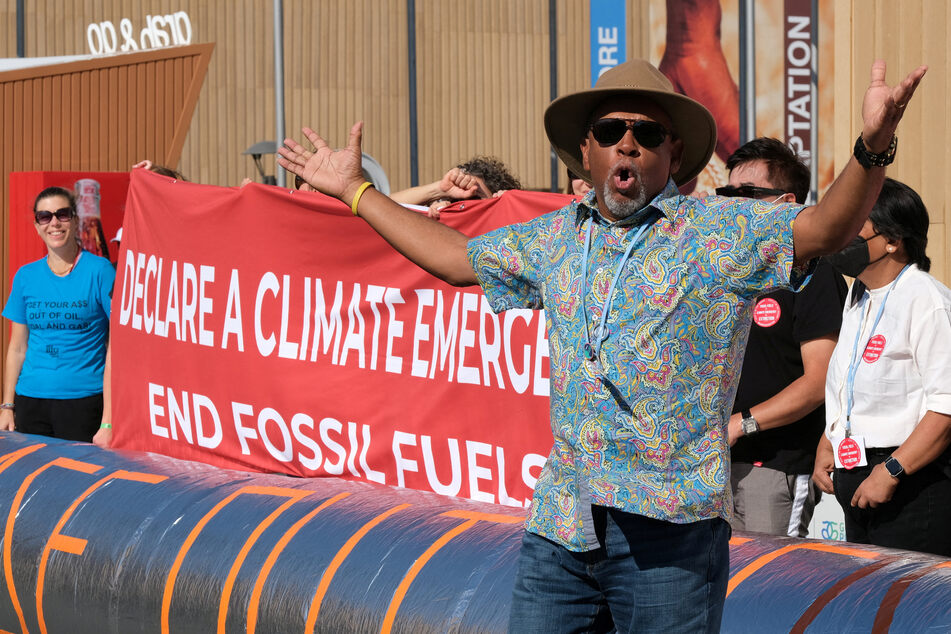 Activists hold a rapid response demonstration to implore countries to phase out all fossil fuels at the COP27 climate summit.