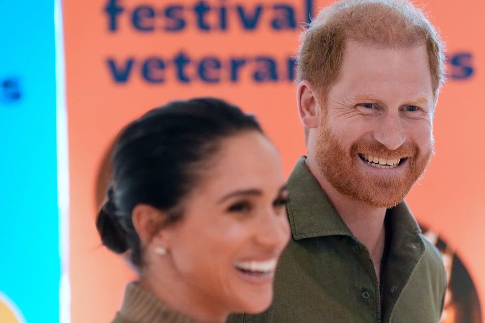 Prince Harry (r.) and Meghan Markle are reuniting with Netflix for a film adapation of a popular Afghan war memoir.