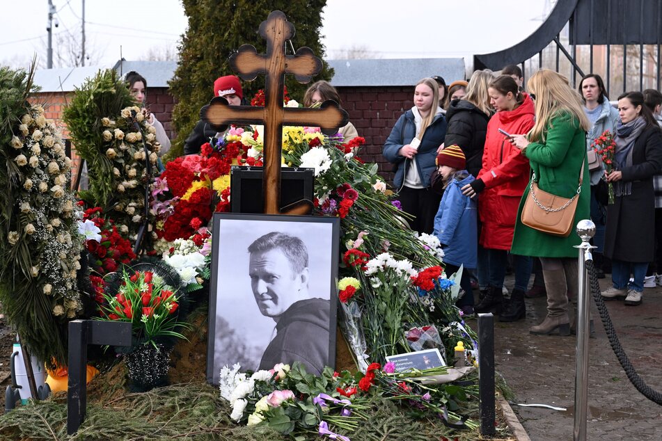 Russians gathered at the grave of opposition leader Alexei Navalny, who died in an Arctic prison in February.