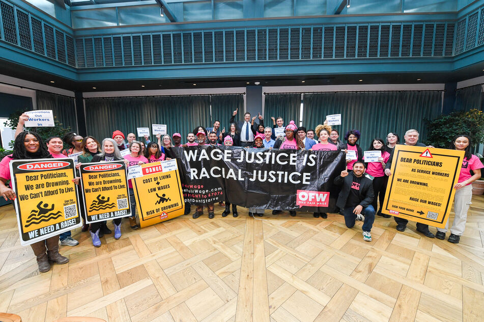 One Fair Wage supporters along with DNC Chair Candidates Ken Martin, Marianne Williamson, and Ben Wikler pose for a photo at the "Win With Workers" Rally and Press Conference at the DNC Midwestern Candidate Forum on January 16, 2025 in Detroit, Michigan.