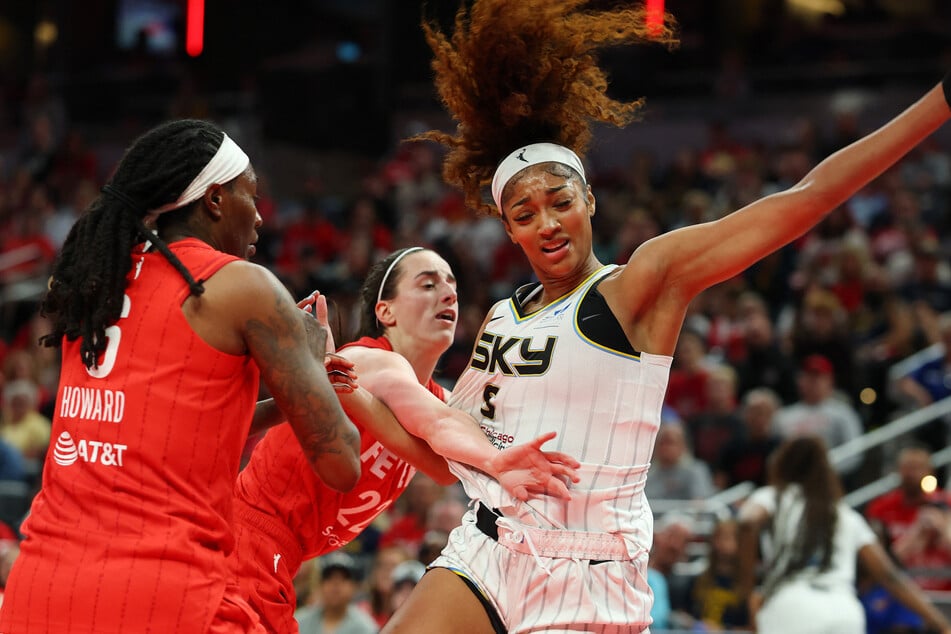 Indiana's 93-58 win over Chicago on Saturday made headlines after a flashpoint in the third quarter when Sky star Angel Reese (r.) was fouled by Indiana's Caitlin Clark (c.)