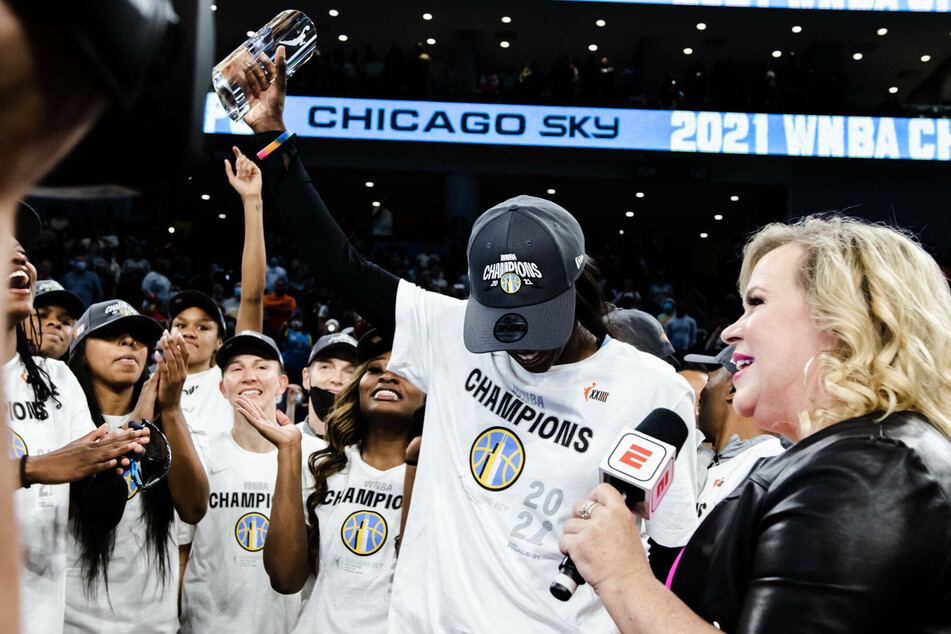 Kahleah Copper (c) of the Chicago Sky receives the WNBA Finals MVP trophy after the team's game four victory.