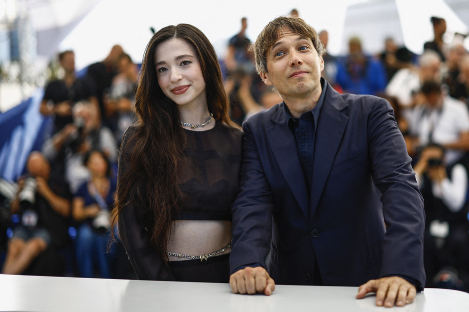 Director Sean Baker and cast member Mikey Madison pose during a photocall for the Anora in competition at the 77th Cannes Film Festival.