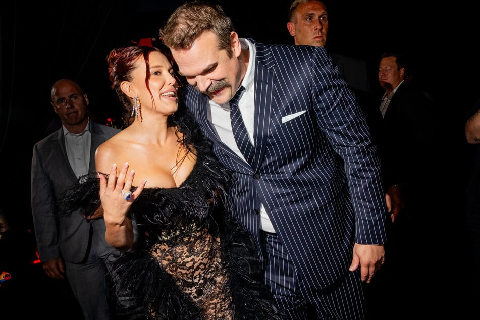 Millie Bobby Brown (l.) and David Harbour (r.) smiled, laughed, and posed for the cameras together at the start of the press tour.