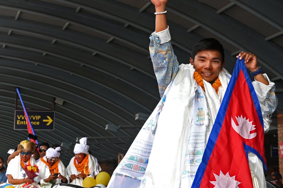 Nima Rinji Sherpa reached the summit of Tibet's 26,335-foot Shisha Pangma on October 9, completing his mission to stand on the world's highest peaks.