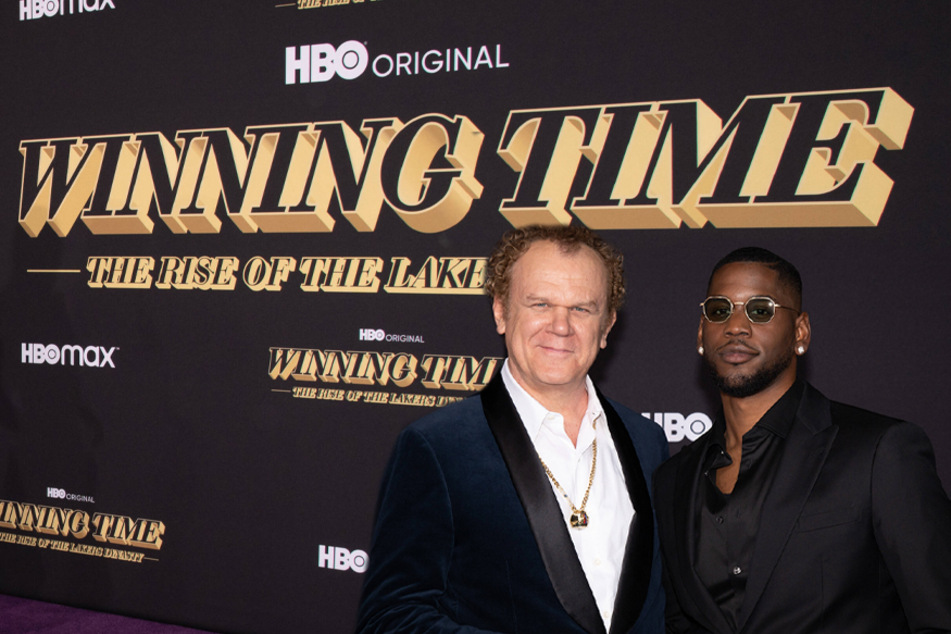 John C. Reilly (l.) and Quincy Isaiah (r.) attended the premiere of HBO's Winning Time: The Rise of the Lakers Dynasty in Los Angeles on Wednesday.