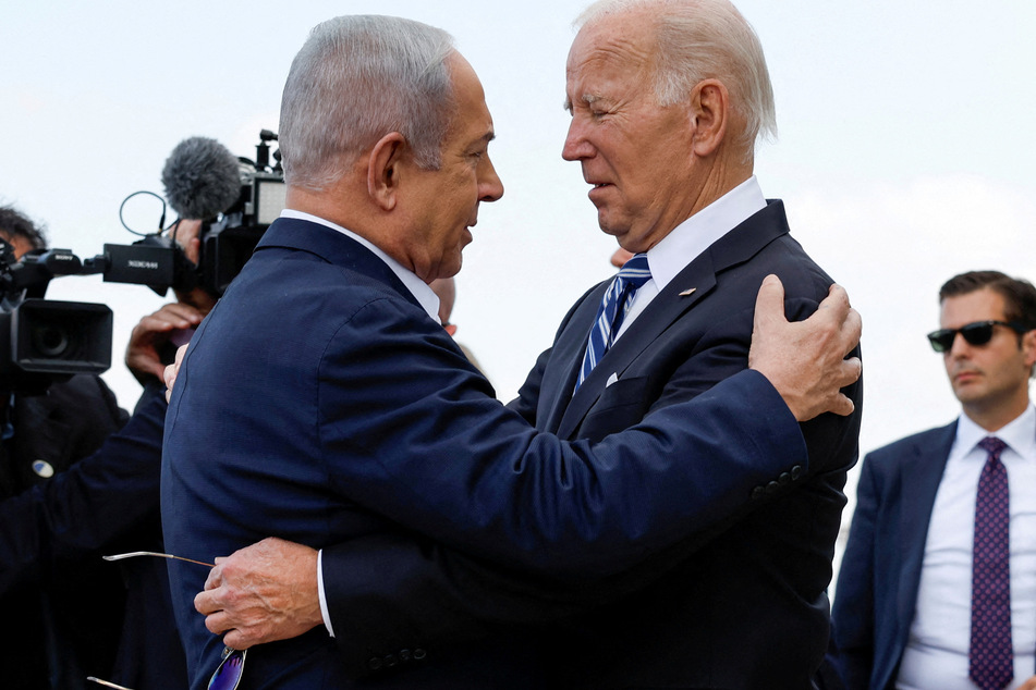 President Joe Biden (r.) is facing accusations of complicity in genocide for continuing to provide military and diplomatic cover to Israel's assault on Gaza.