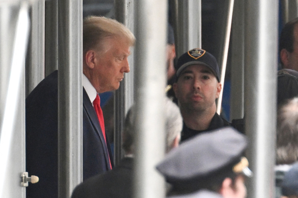 Donald Trump leaving the Manhattan Criminal Court in New York City Thursday after becoming the first ever former American president to face criminal charges.