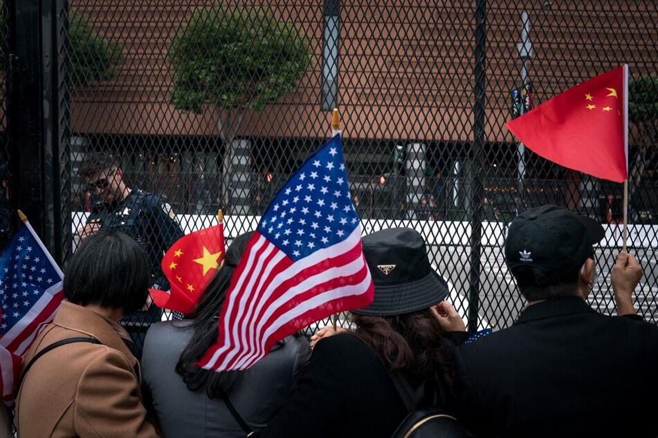 Supporters and well-wishers of Chinese President Xi Jinping wait for his motorcade to arrive at the St. Regis Hotel on November 14, 2023 in San Francisco, California.
