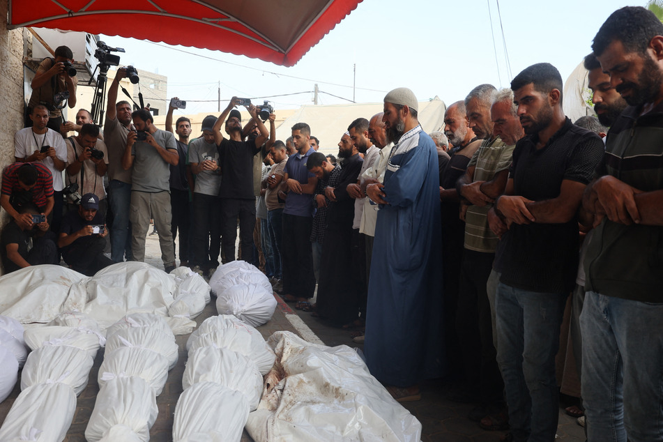 Gaza's civil defense agency said an Israeli air strike in the early hours of Saturday killed 15 members of a Palestinian family, including nine children and three women.