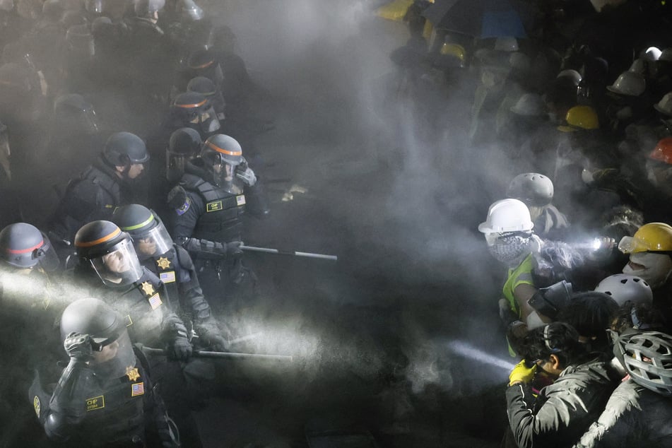 Law enforcement officers are pictured descending on the campus of the University of California, Los Angeles, early on May 2, 2024, to break up the Gaza solidarity encampment.