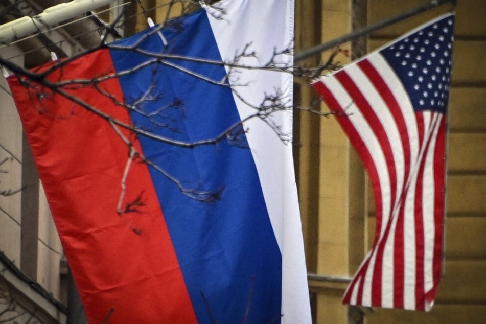 Russian and American flags are pictured outside the US Embassy in central Moscow.