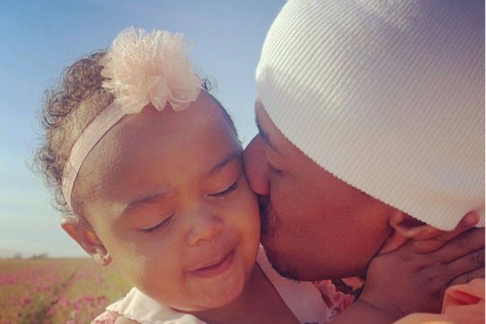 Nick Cannon with his daughter, Powerful Queen.