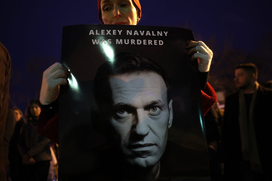 Protesters and mourners rally at the Russian Embassy following the death of Alexei Navalny on February 16, 2024 in Washington, DC.