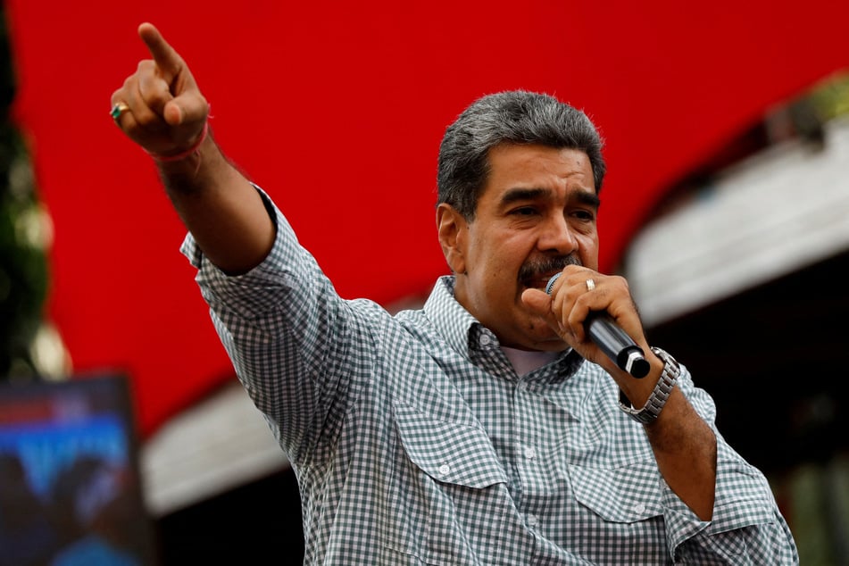 Venezuelan President Nicolas Maduro delivers a speech during a rally to celebrate the results of the July presidential election, in Caracas on August 28, 2024.