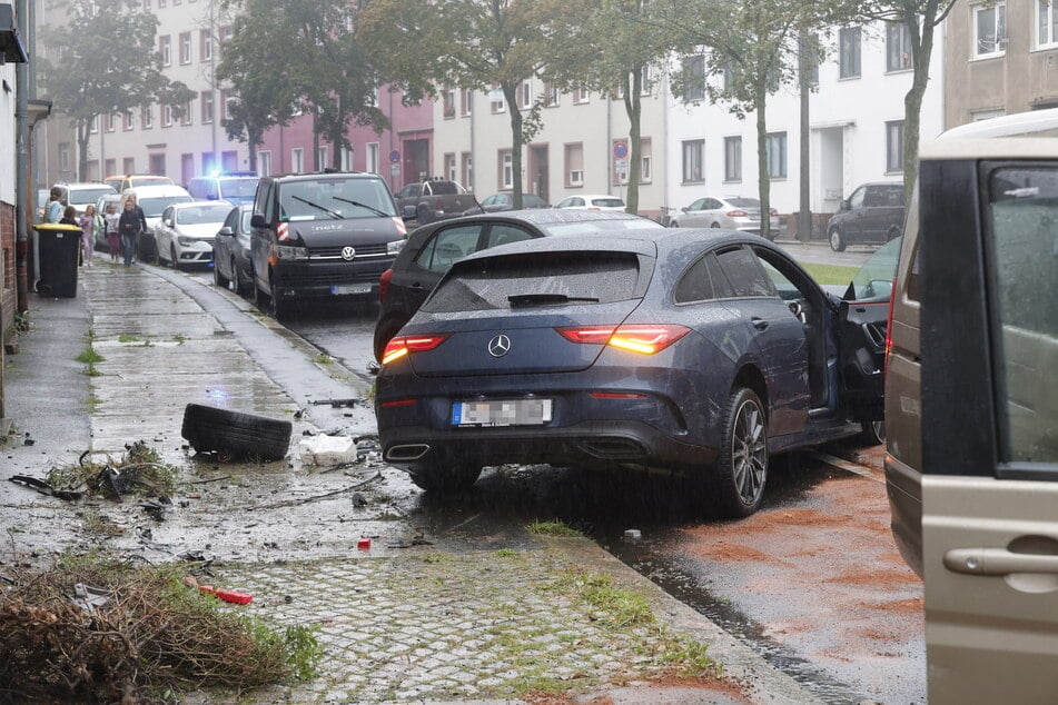 The Mercedes lost a tire during the accident.