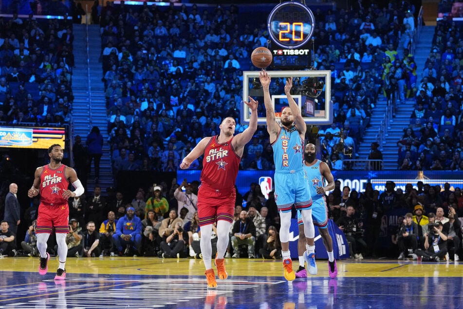 Shaq’s OGs guard Stephen Curry of the Golden State Warriors shoots against Chuck’s Global Stars center Nikola Jokic of the Denver Nuggets during the 2025 NBA All Star Game at Chase Center.