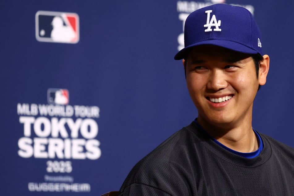 The Los Angeles Dodgers' Shohei Ohtani smiles during a press conference in Tokyo, Japan.