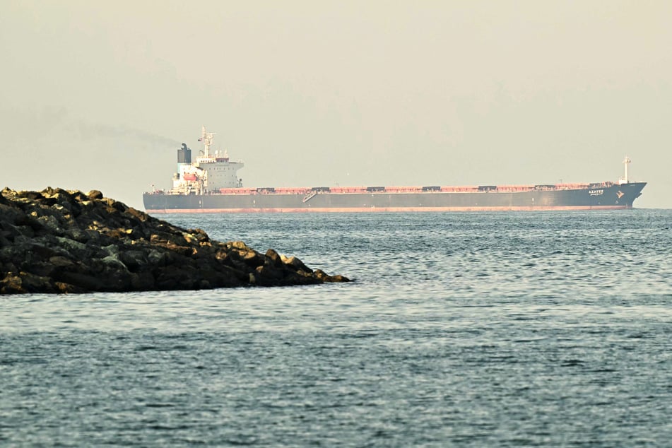 A cargo ship is pictured off the coastal city of Fujairah, UAE, in the Strait of Hormuz.