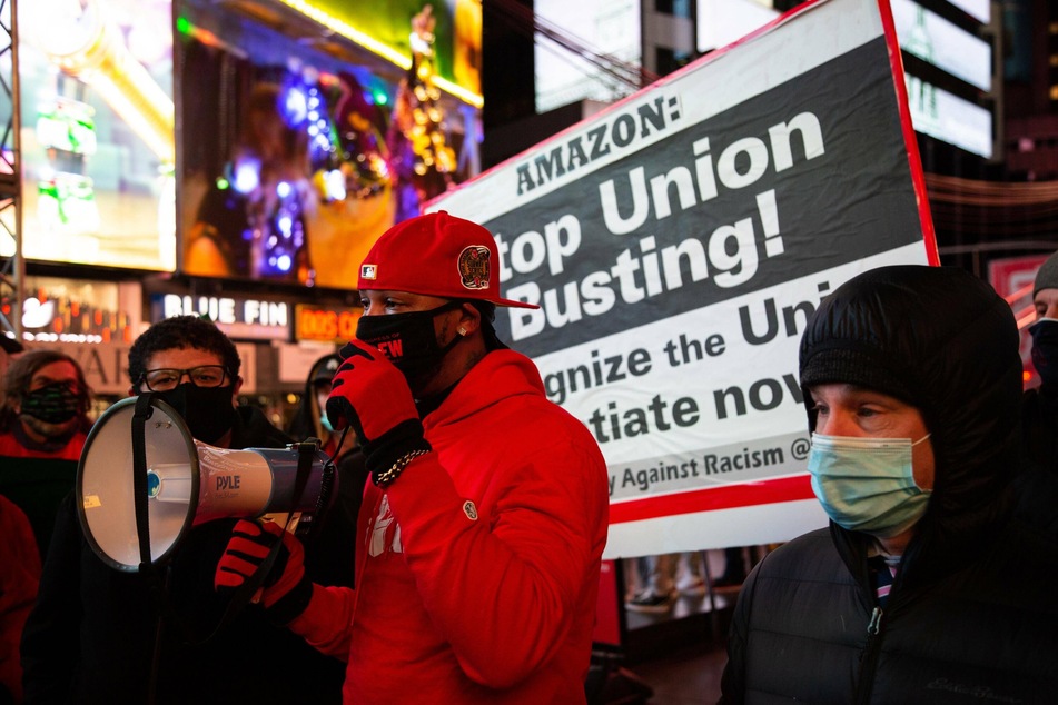 Amazon Labor Union members and allies rally in Times Square against the company's workplace abuses in New York and across the country.