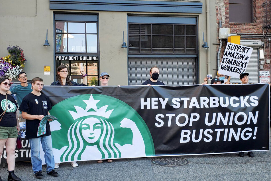 Members of the Starbucks Workers United union protest in front of the company's headquarters on Tuesday.