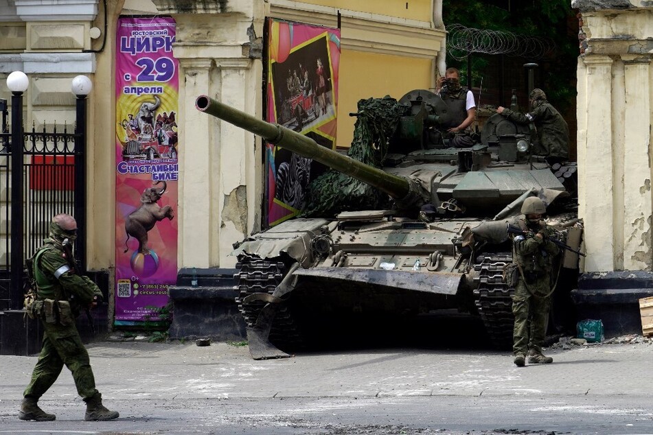Members of the Wagner group patrol in an area near a tank outside a circus building in the city of Rostov-on-Don on June 24, 2023.