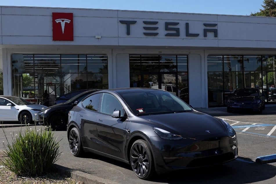 Brand-new Tesla cars sit parked at a dealership in Corte Madera, California.