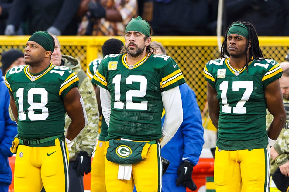 Aaron Rodgers (c.) stands by fellow teammates Randall Cobb (l.) and Davante Adams (r.) during a game at Lambeau Field in Green Bay, Wisconsin.