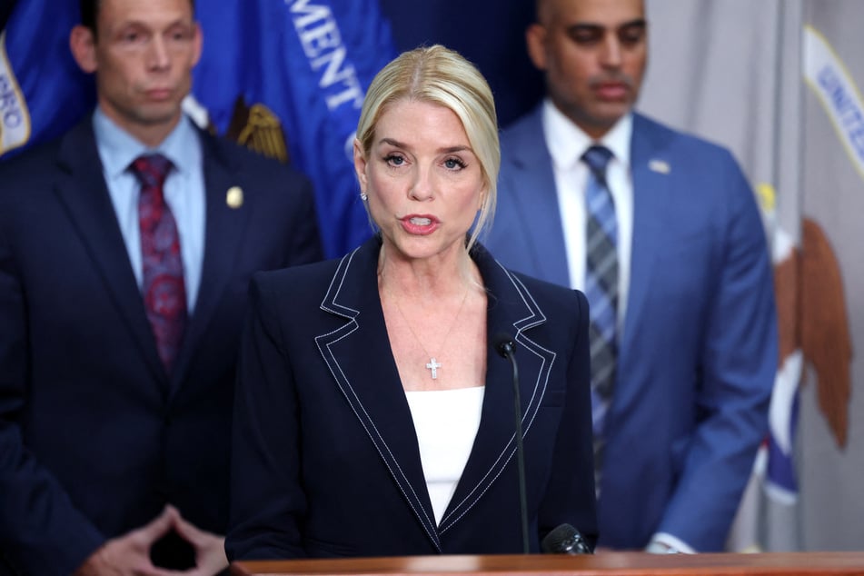Attorney General Pam Bondi fired a Department of Justice employee for holding up the middle finger at the National Guard.