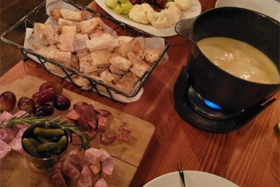 Kashkaval's fondue comes with breads, veggies, and meats as dipping options.